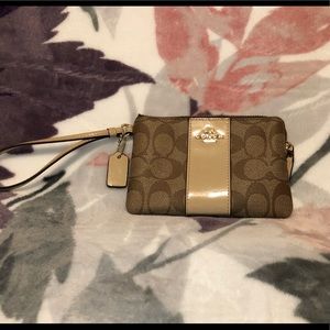 Coach wristlet creamy color with monogram